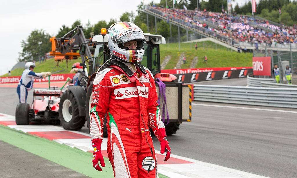 Ferrari's German driver Sebastian Vettel leaves the track after a crash during the Formula One Grand Prix of Austria at the Red Bull Ring in Spielberg, Austria on July 3, 2016.  / AFP / APA / EXPA/DOMINIK ANGERER / Austria OUT        (Photo credit should read EXPA/DOMINIK ANGERER/AFP/Getty Images)