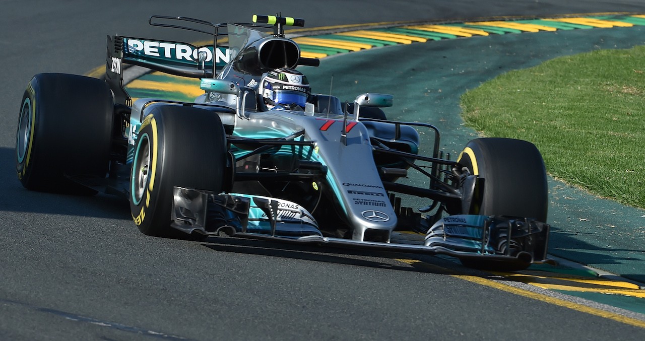 Mercedes' Finnish driver Valtteri Bottas powers through a corner during the Formula One Australian Grand Prix in Melbourne on March 26, 2017. / AFP PHOTO / PAUL CROCK / --IMAGE RESTRICTED TO EDITORIAL USE - STRICTLY NO COMMERCIAL USE--        (Photo credit should read PAUL CROCK/AFP/Getty Images)