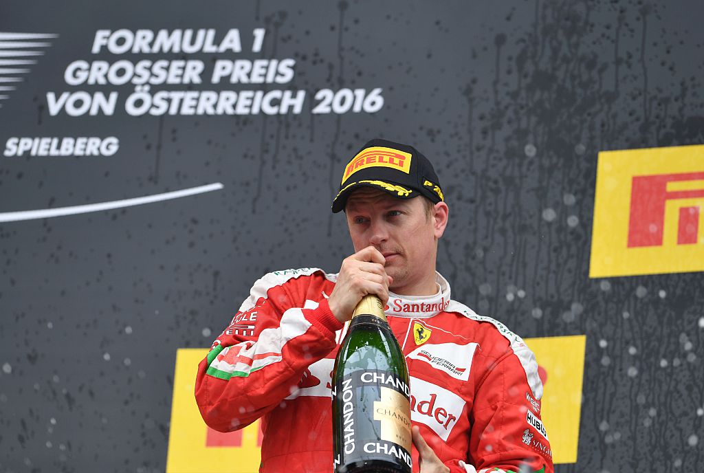 Ferrari's Finnish driver Kimi Raikkonen celebrates on the podium after the Formula One Grand Prix of Austria at the Red Bull Ring in Spielberg, Austria on July 3, 2016.   Mercedes AMG Petronas F1 Team's British driver Lewis Hamilton won the race ahead of Infiniti Red Bull racing's Belgian-Dutch driver Max Verstappen (2nd) and Ferrari's Finnish driver Kimi Raikkonen (3rd). / AFP / ANDREJ ISAKOVIC        (Photo credit should read ANDREJ ISAKOVIC/AFP/Getty Images)