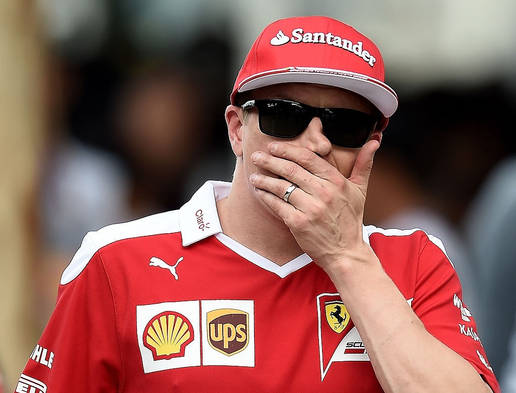 Scuderia Ferrari's Finnish driver  Kimi Raikkonen walks in the paddock after the qualifying session of the Formula One Malaysian Grand Prix in Sepang on October 1, 2016.  / AFP / MANAN VATSYAYANA        (Photo credit should read MANAN VATSYAYANA/AFP/Getty Images)