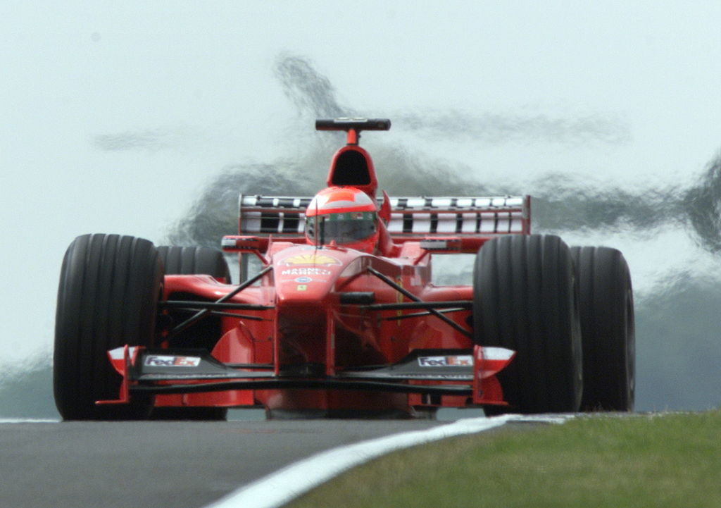 SILVERSTONE, UNITED KINGDOM: Irish driver Eddie Irvine steers his Ferrari on the Silverstone racetrack, 10 July1999 during the third free practice session, one day before the 50th British Formula One Grand Prix. (ELECTRONIC IMAGE) (Photo credit should read PATRICK HERTZOG/AFP/Getty Images)