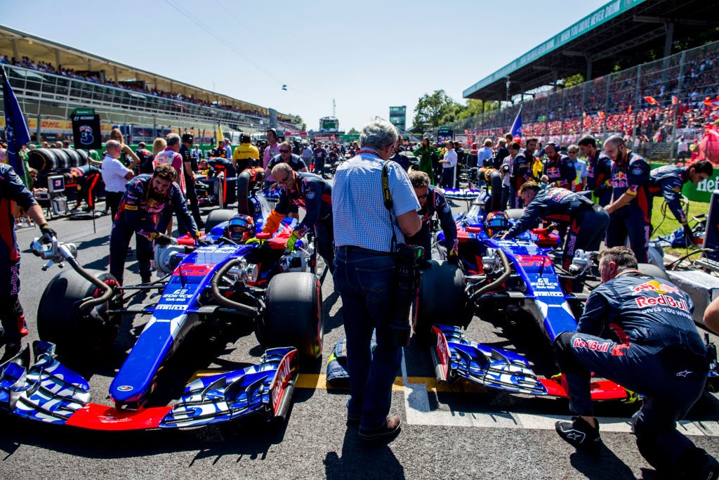 MONZA, ITALY - SEPTEMBER 03: Daniil Kvyat of Russia and Scuderia Toro Rosso and Carlos Sainz of Spain and Scuderia Toro Rosso on the grid before the Formula One Grand Prix of Italy at Autodromo di Monza on September 3, 2017 in Monza, Italy. (Photo by Peter Fox/Getty Images)