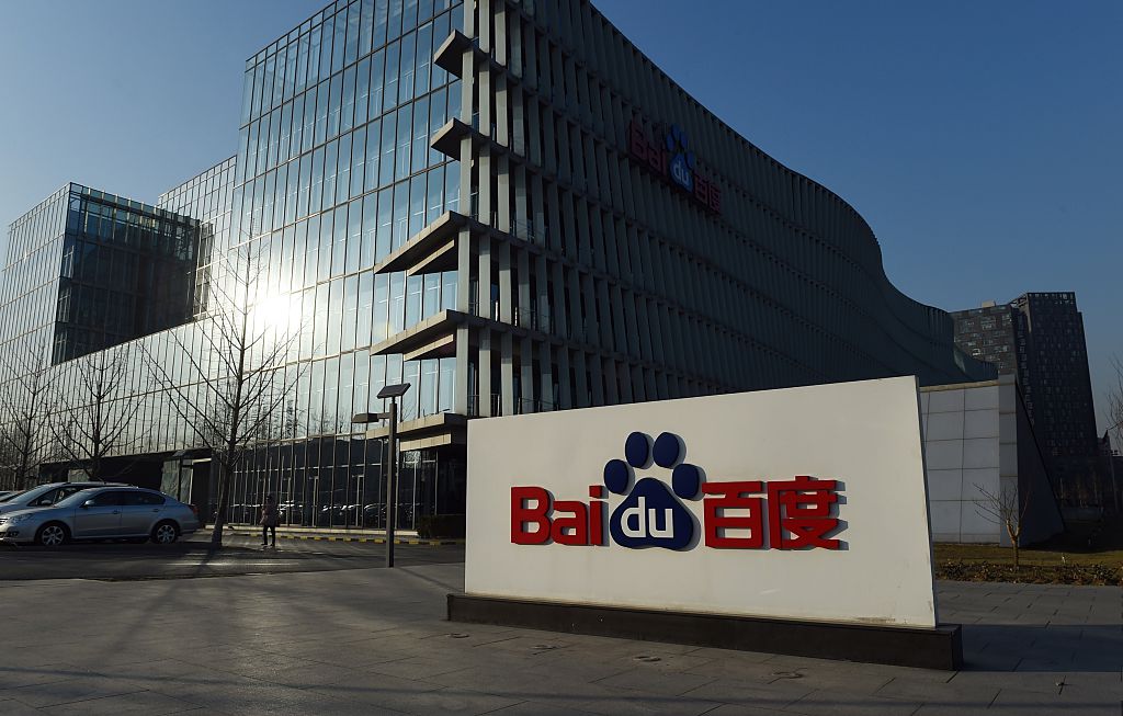 The Baidu logo is seen outside the Baidu headquarters in Beijing on December 17, 2014. Baidu, China's leading search engine, and ride sharing company Uber announced a strategic investment and cooperation agreement in Beijing on December 17. AFP PHOTO / Greg BAKER (Photo credit should read GREG BAKER/AFP/Getty Images)