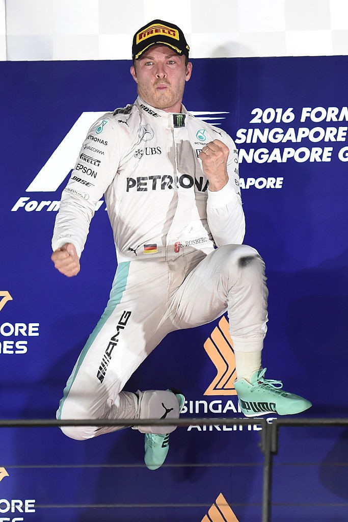 Mercedes AMG Petronas F1 Team's German driver Nico Rosberg celebrates winning the Formula One Singapore Grand Prix in Singapore on September 18, 2016. / AFP / Anthony WALLACE        (Photo credit should read ANTHONY WALLACE/AFP/Getty Images)